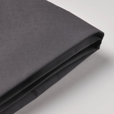 Folded black outdoor canopy on light surface. Premium, uv-resistant fabric with durable stitching.