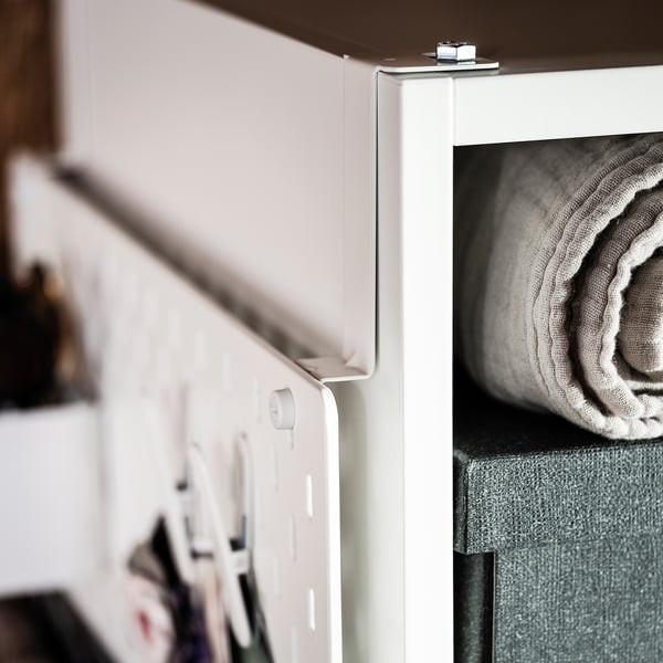 White SKÅDIS connector, metallic, attaches pegboard to wardrobe side.
