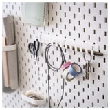 SKÅDIS white pegboard with accessories: scissors, keys, cables, and tape. Organized, modern storage solution.