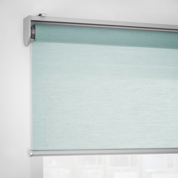 Roller blind partially drawn, showing cordless design and soft closing function.