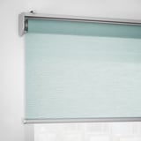 Roller blind partially drawn, showing cordless design and soft closing function.