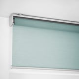 Roller blind, mounted inside window recess, cordless and softly closed.