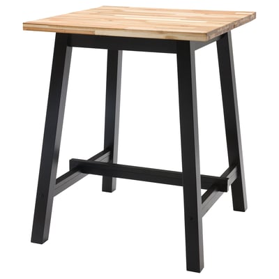 The SKOGSTA table a light wood top and black metal legs, offering a sturdy, rustic square design.