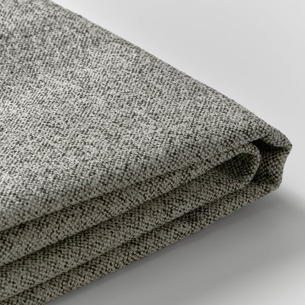 Close-up of soft, textured grey upholstery fabric, folded neatly.