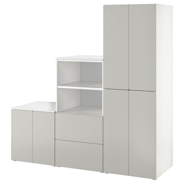 SMÅSTAD white wardrobe set with shelves and drawers, designed for children.
