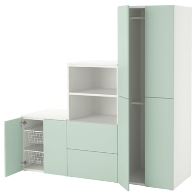 A SMÅSTAD wardrobe in light green, white, and gray, featuring open and closed sections with shelves and drawers.