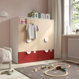 Modern kids room with SMÅSTAD wardrobe, grey t-shirt, red drawers, toy train, white bed.