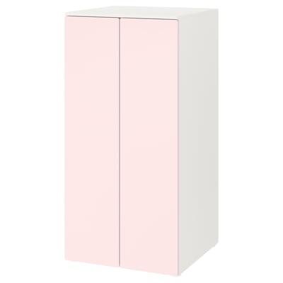 A SMÅSTAD cabinet in white and light pink, featuring two soft-closing doors.