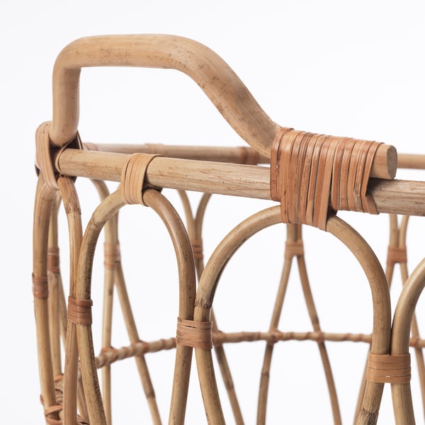 Handcrafted basket with intricate rattan weave and sturdy handle, showcasing fine craftsmanship and natural detailing.