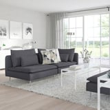 Modern living room with SÖDERHAMN sectional, white coffee table, and large windows.