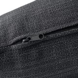 Close-up of a well-crafted, dark grey zipper on a textured fabric, showcasing high-quality construction and durability.