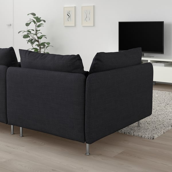 Modern black l-shaped SÖDERHAMN sofa in living room, stylish and comfortable with wooden floor and tv setup.