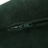 Close-up of dark green zipper on durable, textured fabric, likely from a sofa.