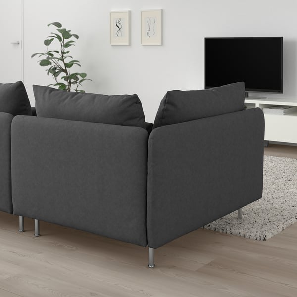 SÖDERHAMN dark grey sofa, modern minimalist design, deep seats, corners visible, tv and plant nearby, white wall background.