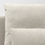 Close-up of a cushioned sofa corner, showcasing high-quality fabric and design.