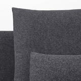 Close-up of dark grey fabric sofa, showcasing smooth texture and clean stitching.