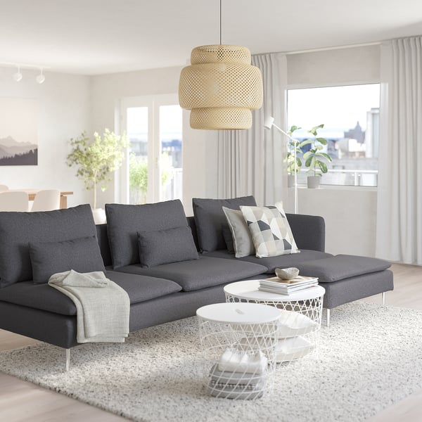 Modern living room with SÖDERHAMN sectional, wicker lamp, coffee table, and plants.