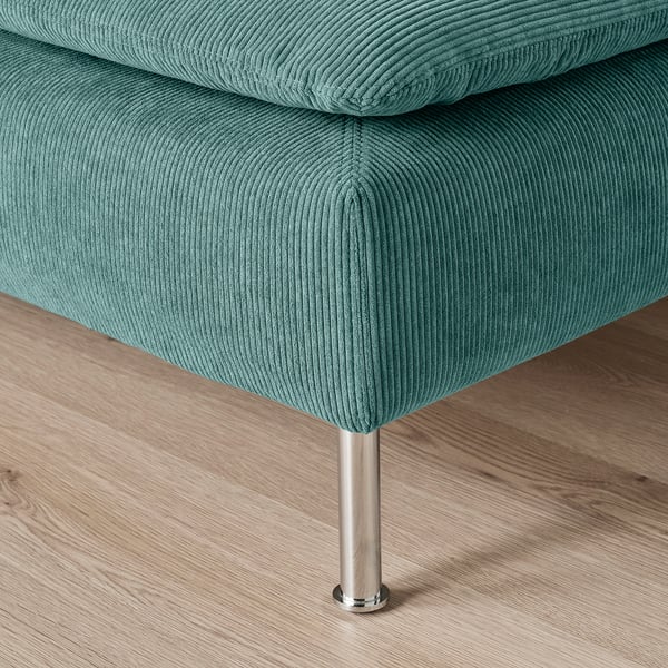 Teal cushioned chair with sleek metal leg showing sturdy design and plush texture.