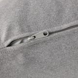 Close-up of zipper on gray fabric, showcasing smooth, sleek design.