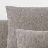 Grey tweed fabric sofa close-up; soft, elegant texture, clean lines.
