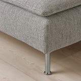 Modern sofa with sleek metal legs, deep cushions, and stylish, light fabric.
