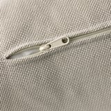 Close-up of a high-quality zipper on a woven, textured fabric, likely from a sofa or cushion cover.