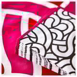 Bright pink and white patterned napkin with intricate designs, showing three layers indicating high absorbency.
