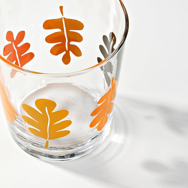 Glass tumbler with vibrant orange leaves, hand-painted. Clear, high quality glass, perfect for autumn.