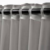 STENFRÖ sheer curtains with grommet top, featuring sheer fabric for diffused sunlight and privacy. Grey in color with heading tape for easy pleating.