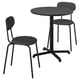 A black STENSELE table and chair set. The table has a round top and four-legged base. Chairs have curved backs and seat cushions.