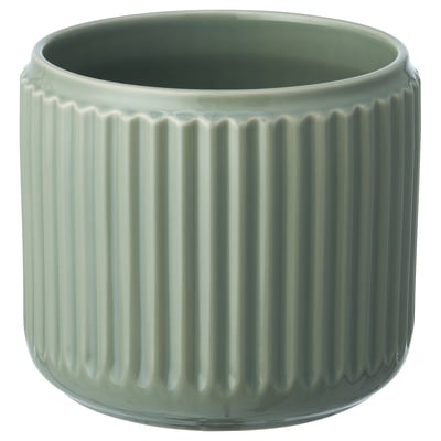 Green ceramic planter with vertical grooves.
