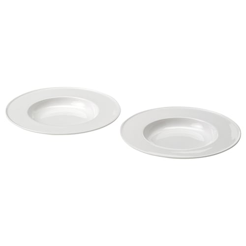 Two identical white porcelain dinnerware plates, flat rim. Elegant, stackable design.