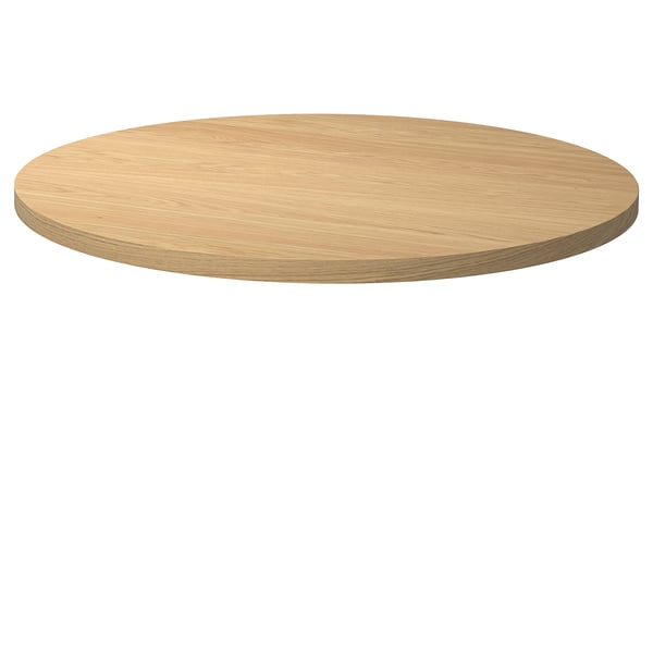 The STOCKHOLM 2025 table top in natural oak colour, crafted from oak veneer and featuring a sleek, circular design with a smooth finish.