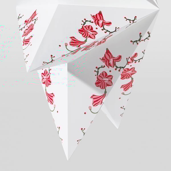 A beautiful, intricately designed red amaryllis lampshade. High-quality paper and metal, ideal for warm, inviting home lighting.