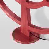 Red wooden candelabra with candle-like led lights, showcasing quality craftsmanship.