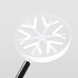 Modern white led snowflake light with sleek handle, emitting soft, warm glow. Ideal for outdoor decoration.