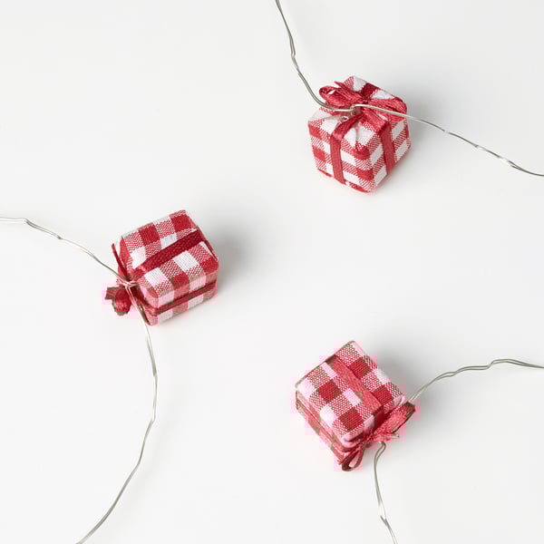 Three checkered gift boxes with glowing wires and led lights.