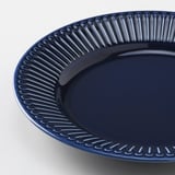 Blue plate with embossed edge pattern.
