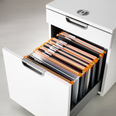 Open white filing cabinet showing orange and gray file folders labeled and holding a4 paper.