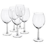 Six clear SVALKA glasses, modern designed with wide bowls, standing on flat surfaces, made of glass.