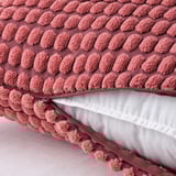 Soft, red cushion cover with zipper, made from recycled polyester.
