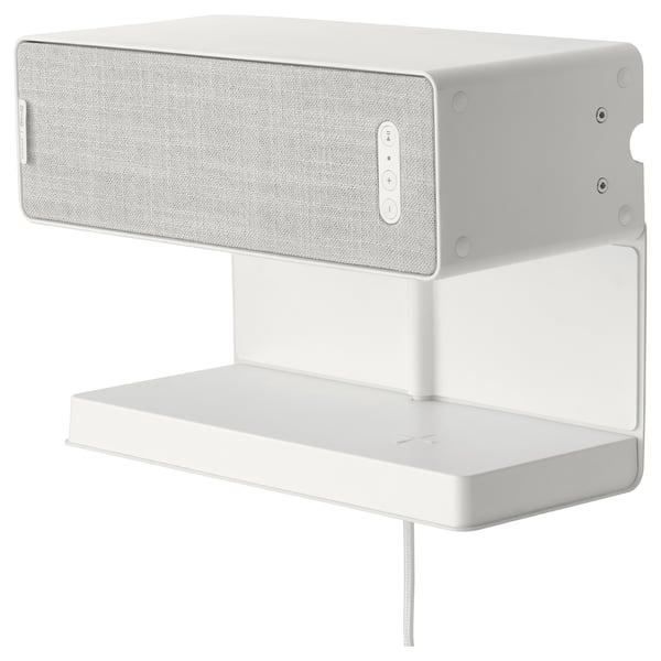 A white SYMFONISK wall-mounted shelf with a wireless speaker and charger. Its sleek and modern.
