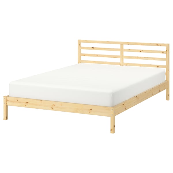 A TARVA light wooden bed with a white mattress. It a simple, modern design with slatted headboard and solid pine construction.