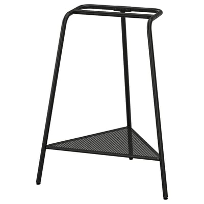Black metal stool with triangular mesh seat and round top bar.