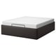 Black TJÅLLE storage bed, rectangular, modern design with white mattress.