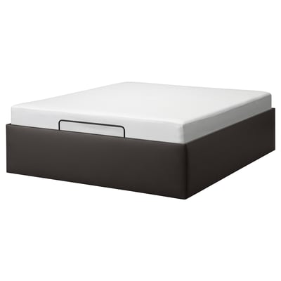 Black TJÅLLE storage bed, rectangular, modern design with white mattress.