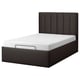 The TJÅLLE bed in dark grey leather-like fabric a modern look with vertical tufted headboard and built-in storage.