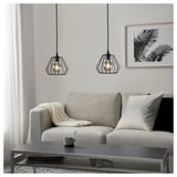 Modern living room with TJUGOTRE lamps, grey sofa, and tropical wall art.