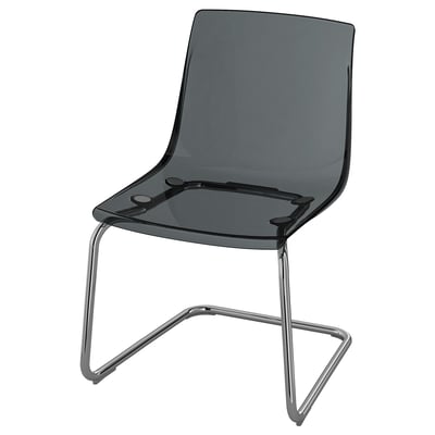 Modern chair TOBIAS with curved, smoke-colored polycarbonate seat and back, supported by chrome-plated legs, minimalist and sleek design.