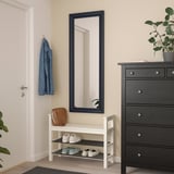 TOFTBYN mirror, large & safe with safety film, above white shoe rack, blue garment left, dark dresser right.